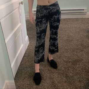 Black Caché pants w white embroidered flowers sz 2